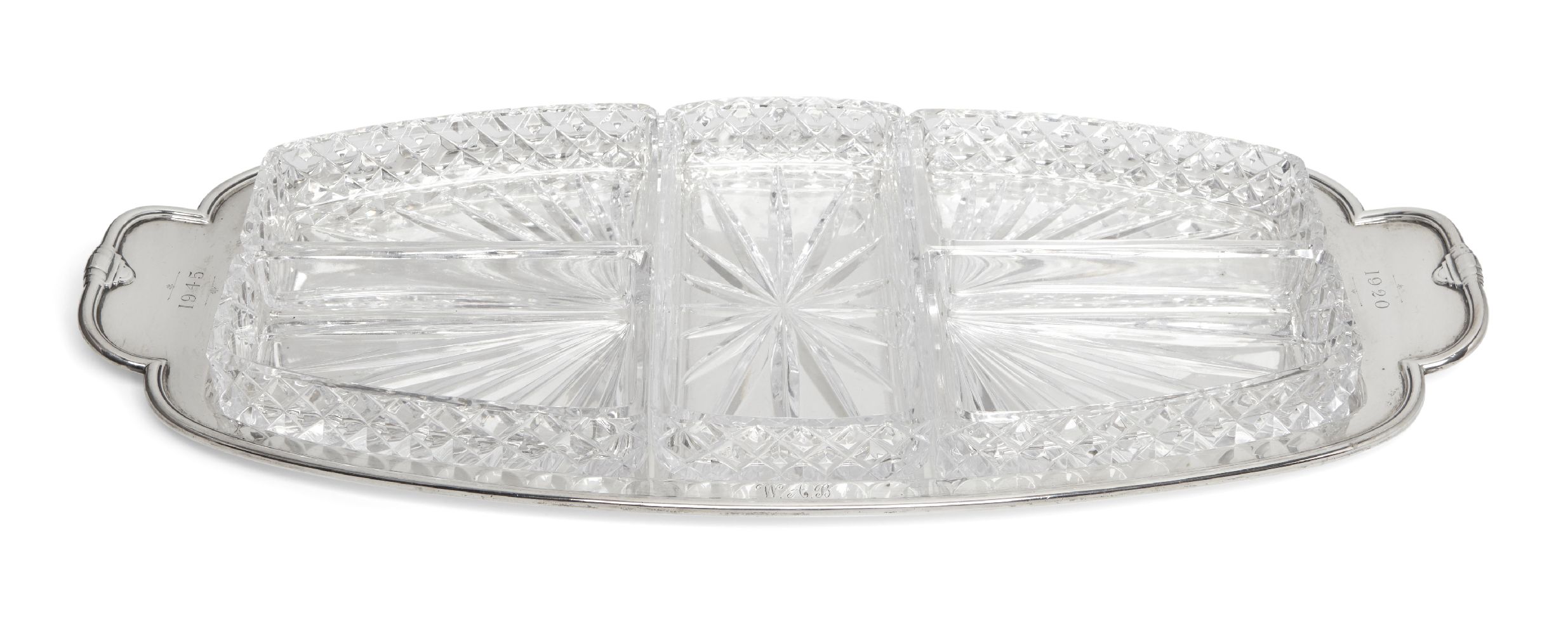 A silver and glass hors d'oeuvres dish, Sheffield. c.1943, Frank Cobb & Co Ltd., of shaped, oblong