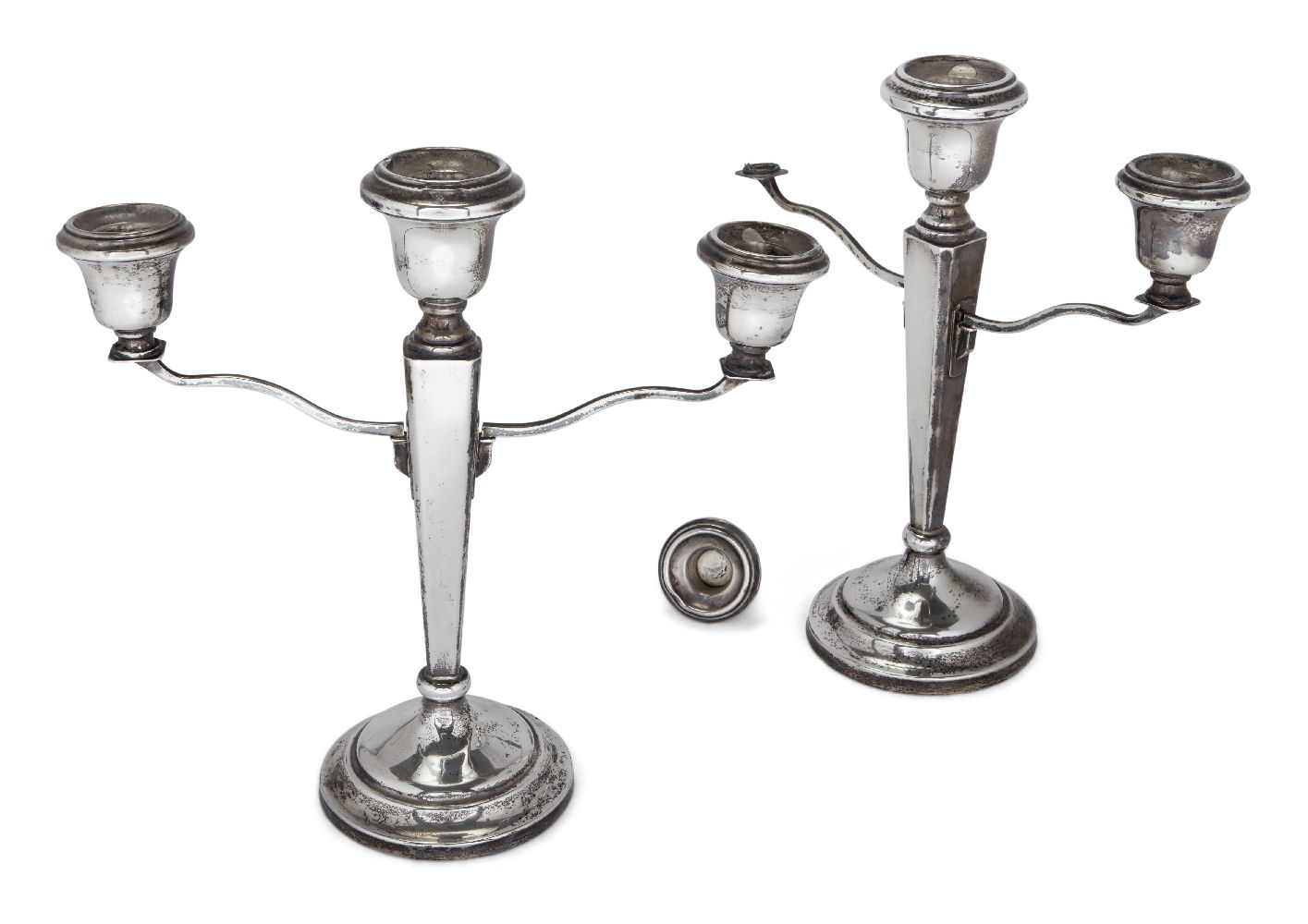 A pair of silver three-branch candlesticks, Birmingham, c.1959, F. H. Adams & Holman, the squared