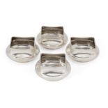 A set of four silver salts, each stamped sterling, designed with square rims to rounded bodies,