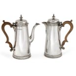 A pair of silver café-au-lait pots, Birmingham, c.1944, Thomas Ducrow & Sons, of tapering