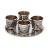 A Russian silver niello coaster with four Russian silver niello beakers, all post 1958, stamped