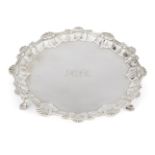 A small George III silver salver, London, c.1763, Elizabeth Cooke, raised on three hoof feet, the