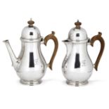 A pair of café-au-lait pots, London, c.1936, Blackmore & Fletcher Ltd, of bulbous form with hinged