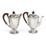 A pair of silver café-au-lait pots, London, c.1938, Edward Barnard & Sons, each pot with curved