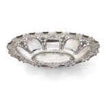An Edwardian pierced silver repousse dish, Chester, c.1910, James Deakin & Sons, of shaped oval