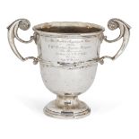 A twin-handled silver trophy cup, London, c.1904, Skinner & Co., designed with bifurcated stylised