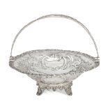 A Victorian silver swing-handled cake basket, London, c.1843, maker's mark rubbed, raised on four