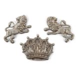 A pair of silver mounts designed as lions, together with a further mount designed as a crown, all