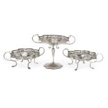 A set of three silver compotes, Birmingham, c.1921, G&C&Co, each designed with bifurcated twin