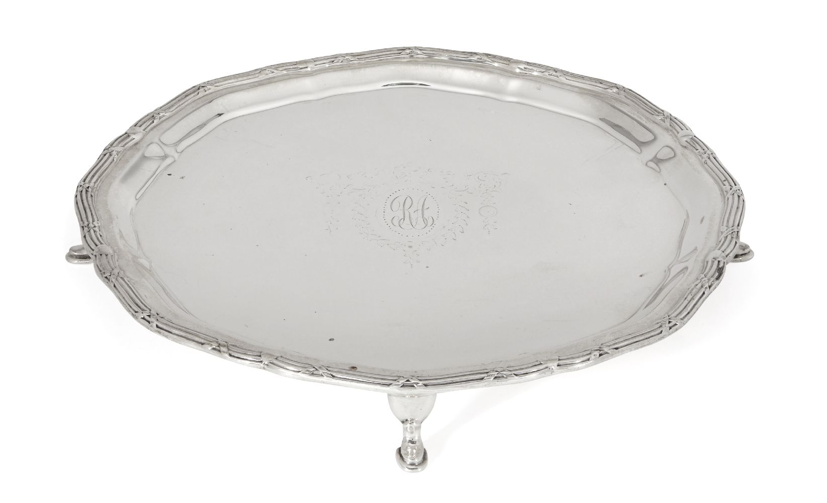 A silver card tray, Chester, c.1919, Barker Brothers, of rounded form and raised on four hoof