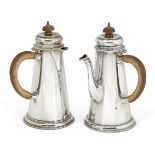 A bachelor's pair of silver café-au-lait pots, London, c.1928, Wakely & Wheeler, of tapering