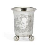 An engraved German silver beaker on three ball feet, stamped 800, the body of the beaker engraved