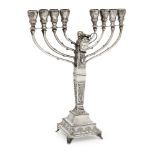 An interesting silver menorah formerly presented to Margaret Thatcher, stamped '925 sterling', the