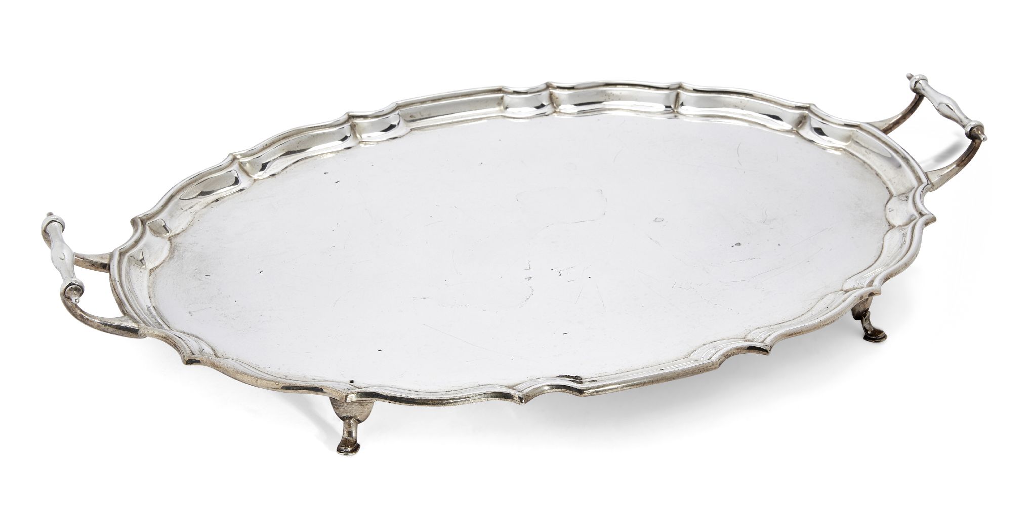 A twin-handled George V silver tray, Birmingham, c.1927, Barker Brothers, of shaped oval form with