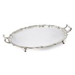 A twin-handled George V silver tray, Birmingham, c.1927, Barker Brothers, of shaped oval form with
