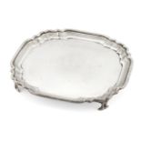 A small silver salver with shaped edge, London, c.1914, Goldsmiths and Silversmiths Co., of square