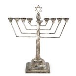 A silver menorah with Star of David finial, London, c.1971, A. Taite & Sons Ltd., the angular