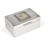 A silver cigarette box with integral clock to lid, London, c.1928, Cornelius Desormeaux Saunders &