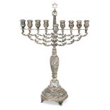 A large silver menorah by Joseph Zweig, London, c.1921, with foliate branches centred by a Star of