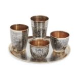 A Russian silver niello coaster with four various Russian silver niello beakers, all post 1958