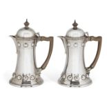 An Edwardian silver bachelor's café-au-lait pair, London, c.1907, Wakely & Wheeler, each pot of