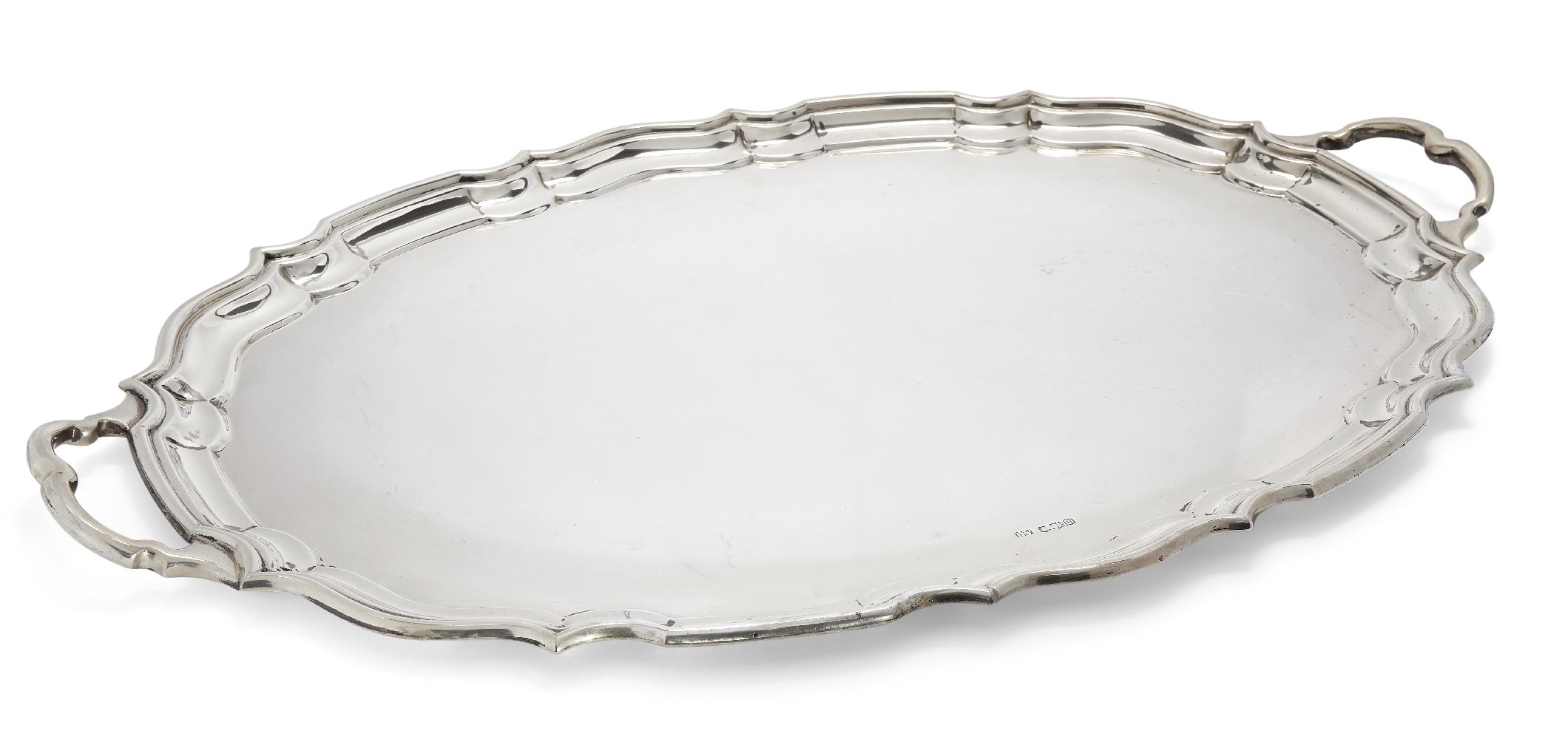 A large silver tray with Chippendale border, Sheffield, c.1929, Lee & Wigfull, of shaped oval