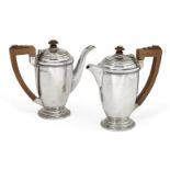 A pair of silver Mappin & Webb café-au-lait pots, Birmingham, c.1938, the plain body of each