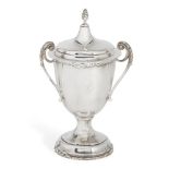 A silver three-handled cup with cover, Birmingham, c.1926, S. Blanckensee & Sons Ltd., the cup