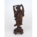 A Chinese hardwood figure of Zhongli Quan, early 20th century, carved on a naturalistic base with