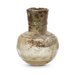 A small Islamic facetted glass bottle, 9th-10th century, the flaring mouth with seven facets and the