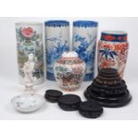 Seven pieces of Oriental porcelain, 19th-20th century, comprising: a famille rose hat stand, 28cm