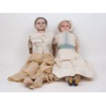 A Victorian wax over composition doll, circa. 1850 -60, in original under garments, with leather