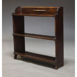 A late Victorian oak free standing open bookcase , with three shelves, 81cm high, 76cm wide, 20cm