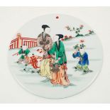 A Chinese porcelain circular plaque, Republic period, painted in famille verte enamels with two