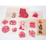 A large collection of Modern Chinese window paper cuttings, in a wide variety of designs and