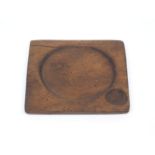 A carved wood trencher plate, 16th century, of typical form, 18.5cm x 17cmPlease refer to department