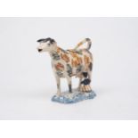 A Staffordshire pearlware cow creamer, late 18th/early 19th century, designed with a milkmaid and