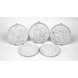 A group of five Parian porcelain roundels, designed with neo-classical reliefs, largest 14.5cm