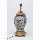 A Japanese Arita porcelain ormolu mounted vase converted to a table lamp, late 19th Century, of