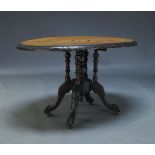 A Victorian walnut and ebonised loo table, the oval top centred by marquetry panel, on turned column