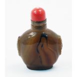 A Chinese agate snuff bottle, early 20th century, carved with simulated beast ring handles and a