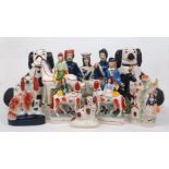 A collection of Staffordshire figural groups and figures, late 19th century and later (some