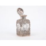 An Edwardian silver mounted cut glass perfume bottle, William Comyns, London 1901, repousse