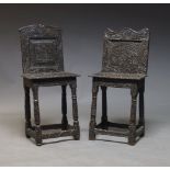 A carved oak correctional chair, early 20th Century,with overall foliate carved decoration, the