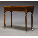 An early Victorian mahogany desk, the rectangular top with three quarter gallery, above two frieze