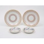 A pair of Derby saucer-dishes, 19th century, of circular form, each designed with recurrent rose