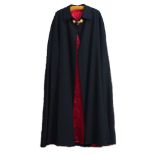 A Military style cloak, 20th century, of cape form, with folding collar, in a black palette, red