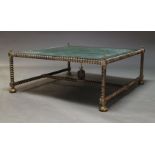A cast metal coffee table, late 20th Century, with square green marble top, on writhen frame and