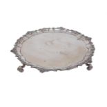 A 20th century Egyptian 800 silver salver, the shaped, decorative edge with shell points to a plain,