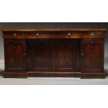 A William IV mahogany inverse breakfront sideboard, with three frieze drawers, above four cupboard
